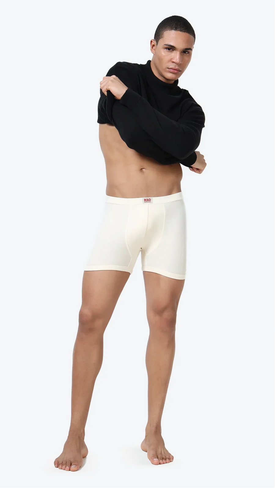 Folded organic cotton trunks beside a gentle-wash care label
