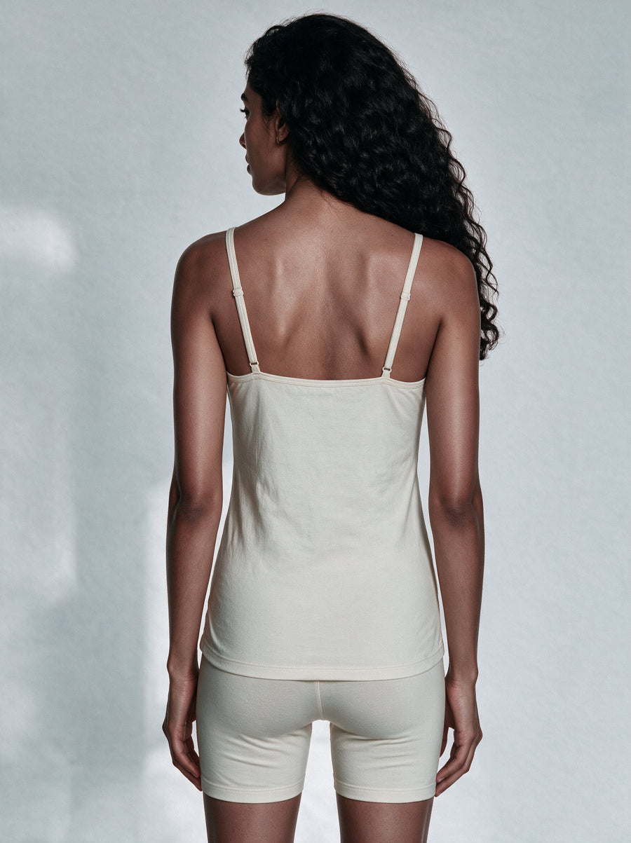 Organic cotton camisole and a satin slip laid side by side for comparison