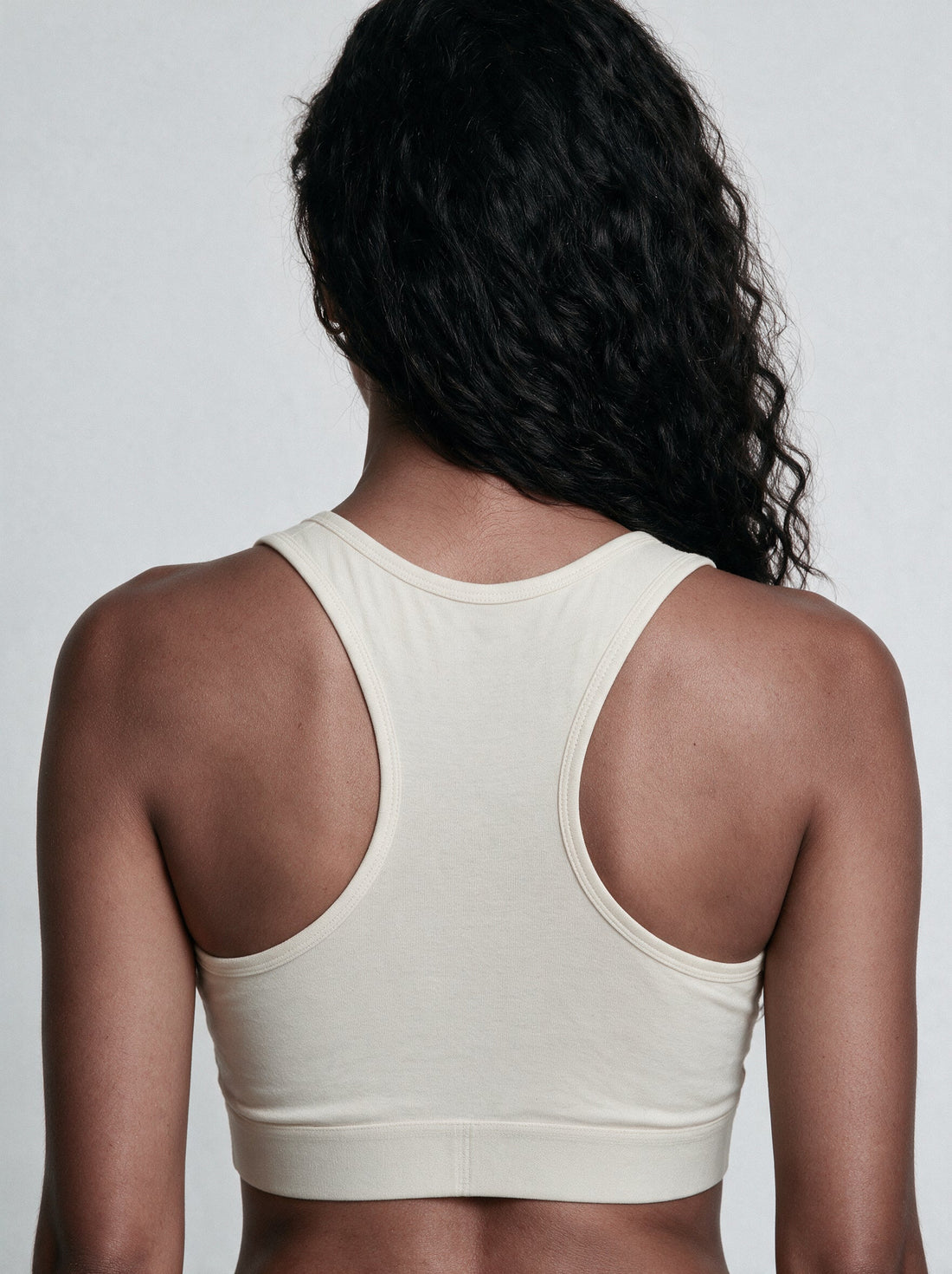 Organic cotton sports bra and everyday bra shown side by side for comparison
