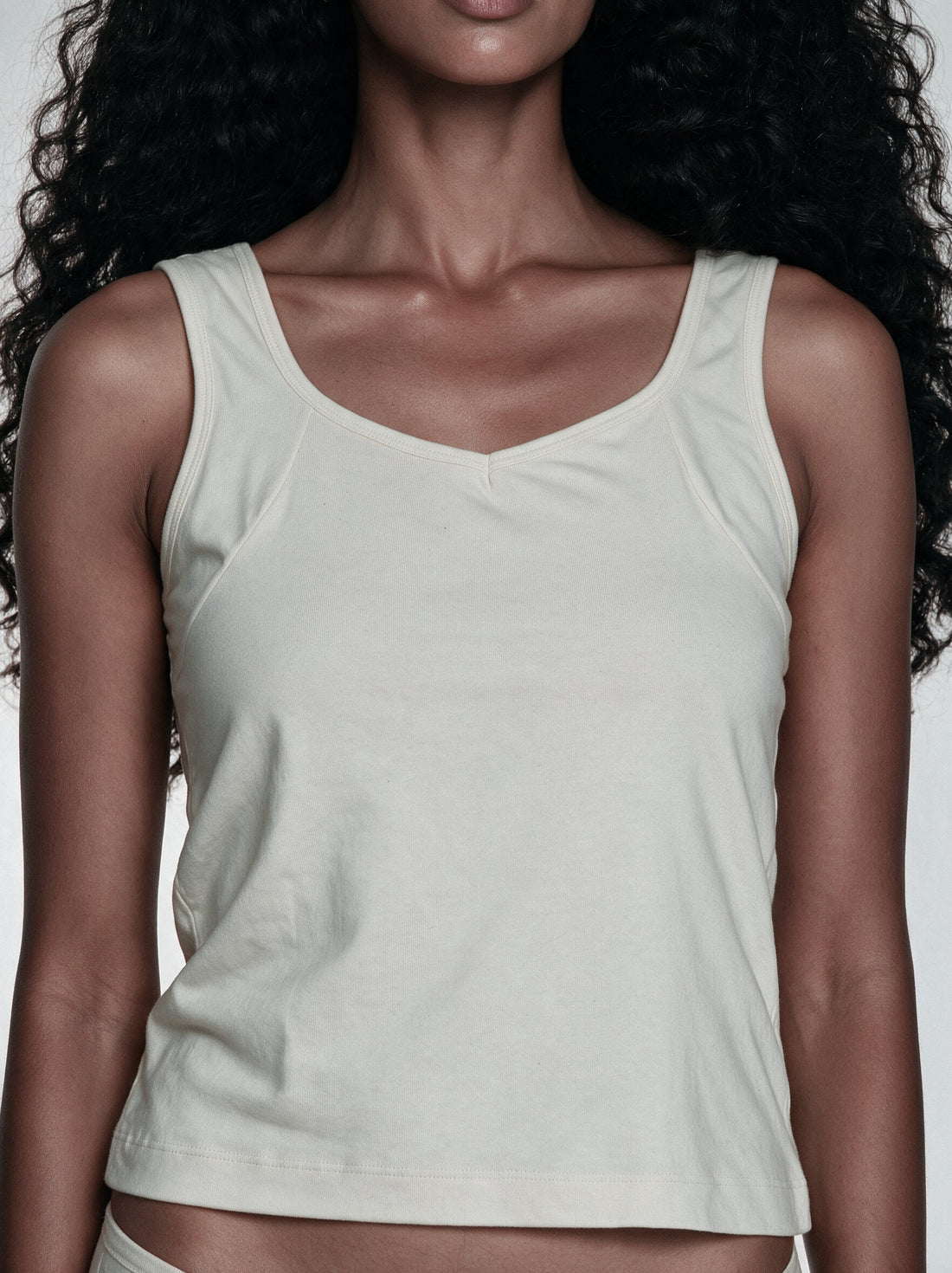 Three outfit looks styled with an undyed organic cotton camisole