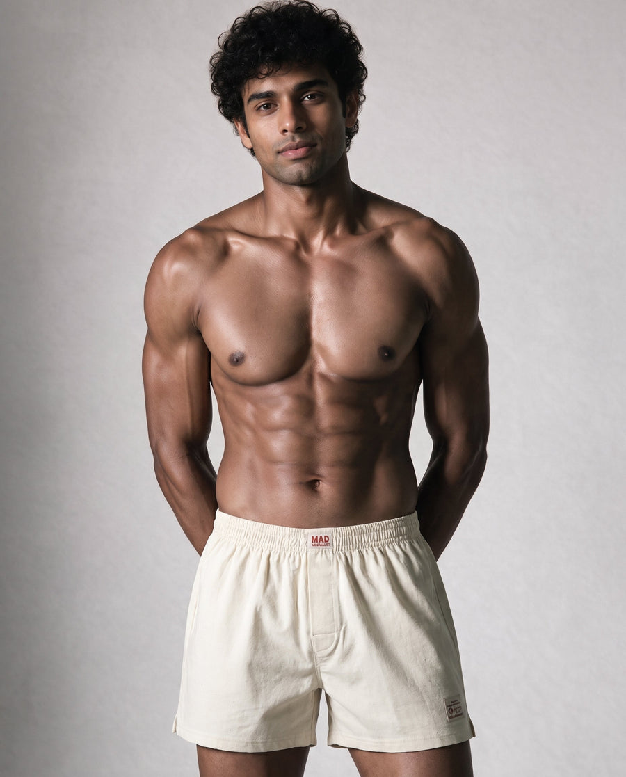 Organic cotton boxer shorts for men laid flat in natural tones